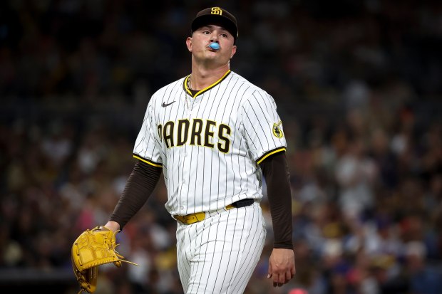 Adrian Morejon #50 of the San Diego Padres blows a bubble during the seventh inning against the New York Mets at Petco Park on Tuesday, July 29, 2025 in San Diego, CA. (Meg McLaughlin / The San Diego Union-Tribune)