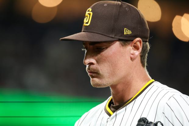 Ron Marinaccio #97 of the San Diego Padres walks back to the dugout during the eighth inning against the New York Mets at Petco Park on Tuesday, July 29, 2025 in San Diego, CA. (Meg McLaughlin / The San Diego Union-Tribune)