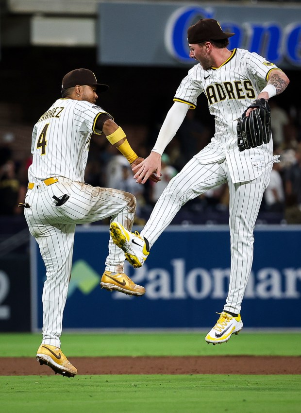 Luis Arraez #4 of the San Diego Padres and Jackson Merrill #3 celebrate after the Padres defeated the New York Mets at Petco Park on Tuesday, July 29, 2025 in San Diego, CA. (Meg McLaughlin / The San Diego Union-Tribune)