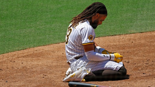 Fernando Tatis Jr. #23 of the San Diego Padres reacts after he was hit by a pitch on the hand in second inning against the New York Mets at Petco Park on July 30, 2025 in San Diego, CA. (K.C. Alfred / The San Diego Union-Tribune)