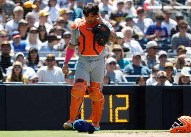 Francisco Alvarez #4 of the New York Mets reacts after being hit by a foul ball in the fifth inning against the San Diego Padres at Petco Park on July 30, 2025 in San Diego, CA. (K.C. Alfred / The San Diego Union-Tribune)