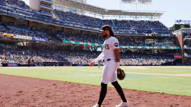 Fernando Tatis Jr. #23 of the San Diego Padres walks to the dugout in between innings against the New York Mets at Petco Park on July 30, 2025 in San Diego, CA. (K.C. Alfred / The San Diego Union-Tribune)