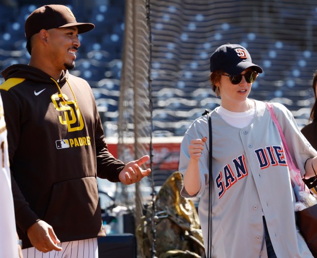 Jeremiah Estrada #56 of the San Diego Padres talks with actress Emma Stone after a game against the New York Mets at Petco Park on July 30, 2025 in San Diego, CA. (K.C. Alfred / The San Diego Union-Tribune)