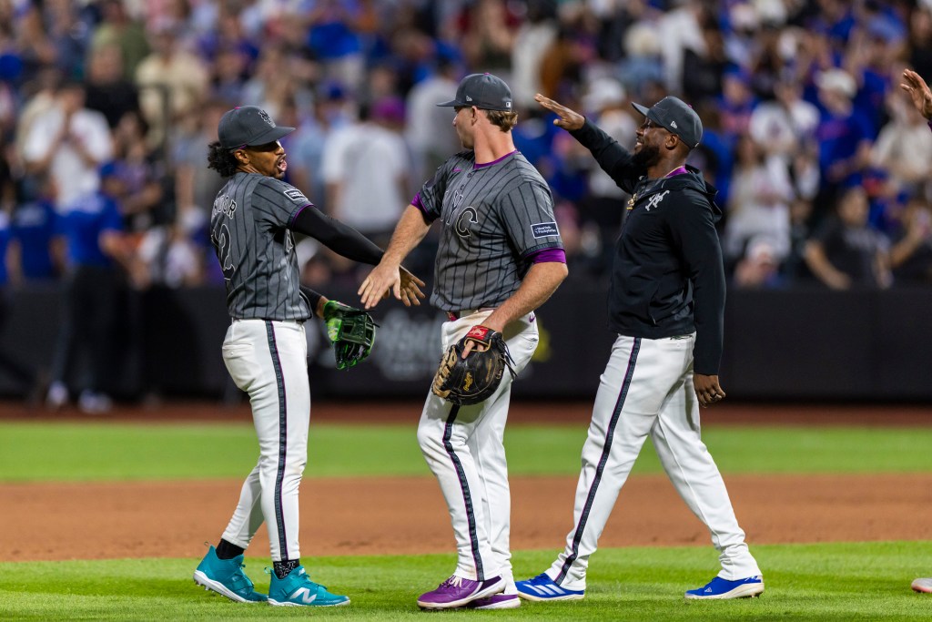 Starling Marte (right) celebrates with Pete Alonso (center) and Francisco Lindor after the Mets' 3-2 win over the Angels on July 22, 2025.