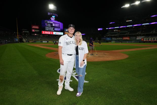 Rockies All-Star catcher Hunter Goodman, left, with his wife, Sydney, at Coors Field. (Photo courtesy of Sydney Goodman)