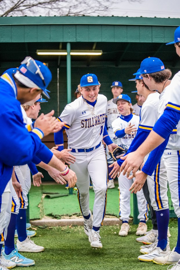 Stillwater High School senior shortstop Ethan Holliday takes the field as he's greeted by teammates. Holliday is the Rockies' 2025 first-round draft choice. (Photo courtesy of Billy Jones)