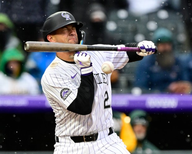 Colorado Rockies outfielder Tyler Freeman (2) foul-tips at the plate against Athletics pitcher Noah Murdock (58) in the 10th inning on opening day at Coors Field in Denver, on Friday, April 4, 2025. (Photo by Andy Cross/The Denver Post)