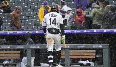Rockies lose frigid home opener to A's in 11 innings