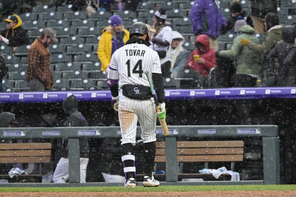 Rockies lose frigid home opener to A's in 11 innings