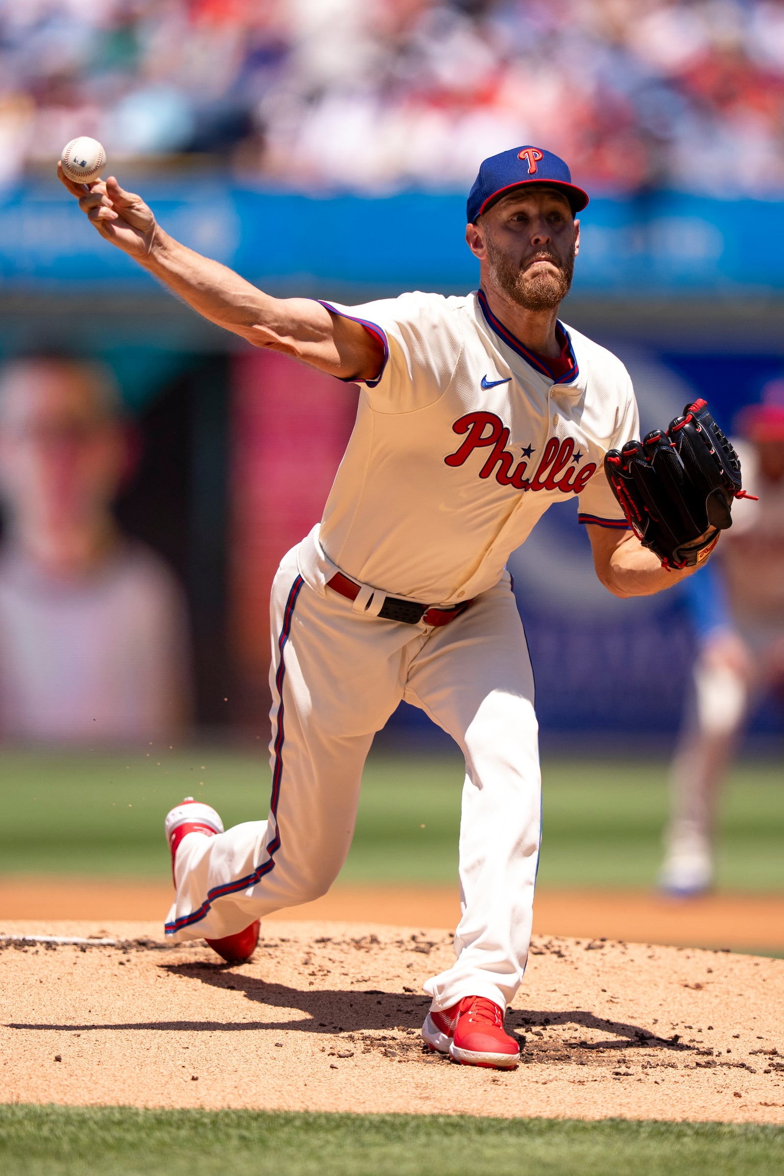 Philadelphia Phillies starting pitcher Zack Wheeler delivers during the first inning of a baseball game against the Cincinnati Reds, Sunday, July 6, 2025, in Philadelphia. (AP Photo/Chris Szagola)