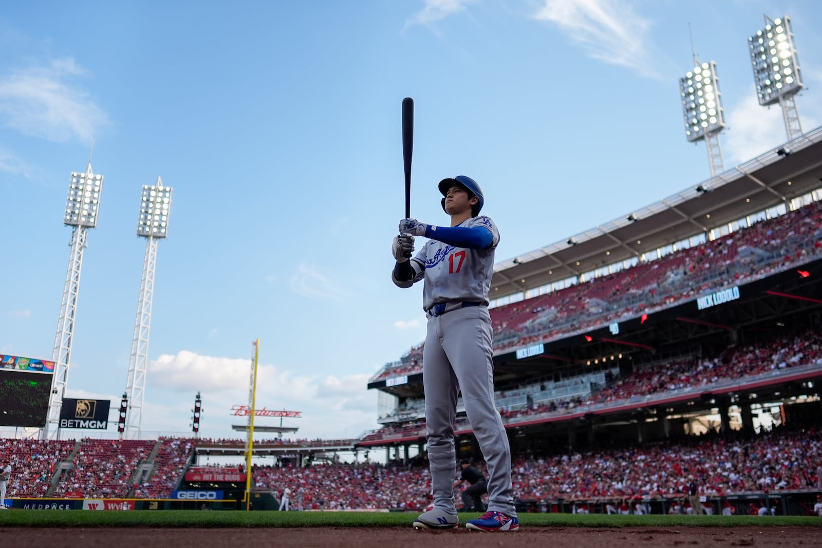 Los Angeles Dodgers' Shohei Ohtani stands near the on-deck circle before a baseball game against the Cincinnati Reds, Tuesday, July 29, 2025, in Cincinnati. (AP Photo/Carolyn Kaster)