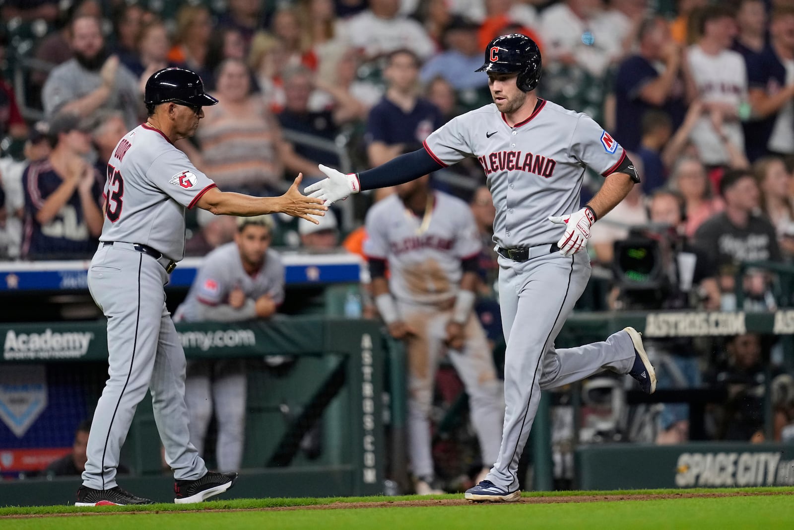 Cleveland Guardians' David Fry, right, celebrates with third base coach Rouglas Odor after hitting a home run against the Houston Astros during the ninth inning of a baseball game Monday, July 7, 2025, in Houston. (AP Photo/David J. Phillip)