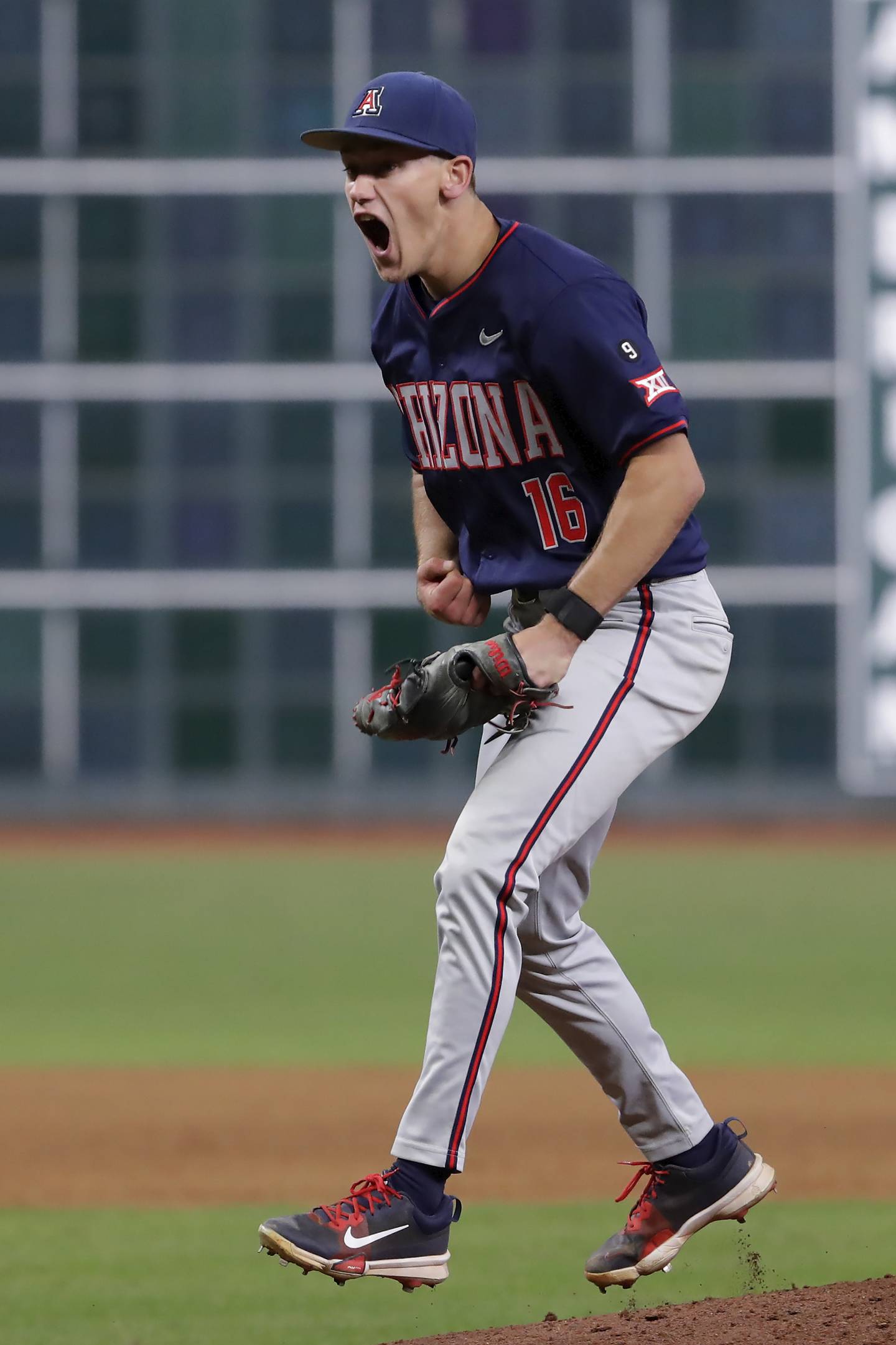 Arizona closing pitcher Casey Hintz celebrates after striking out Texas A&M batter Jace LaViolette to win 3-2 during an NCAA baseball game on Friday, Feb. 28, 2025, in Houston. (AP Photo/Michael Wyke).
