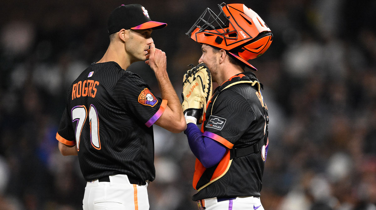 San Francisco Giants pitcher Tyler Rogers (71) talks to catcher Patrick Bailey (14) against the Pittsburgh Pirates during the eighth inning at Oracle Park.