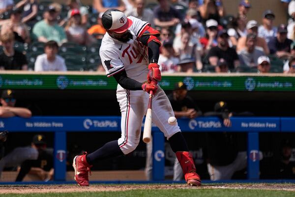 Minnesota Twins' Byron Buxton (25) hits a solo home run for the cycle during the seventh inning of a baseball game against the Pittsburgh Pirates, Saturday, July 12, 2025, in Minneapolis. (AP Photo/Abbie Parr)