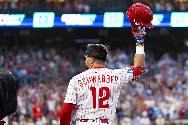 Jul 19, 2025; Philadelphia, Pennsylvania, USA; Philadelphia Phillies outfielder Kyle Schwarber (12) comes out of the dugout for a curtin call after his grand slam during the sixth inning against the Los Angeles Angels at Citizens Bank Park. Mandatory Credit: Bill Streicher-Imagn Images