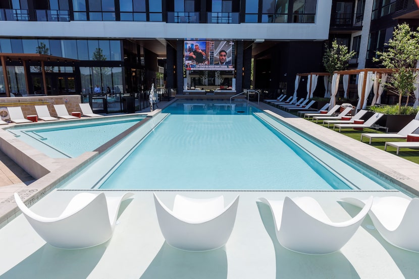 The pool area with a 16-foot screen is seen at One Rangers Way apartment complex, Monday,...