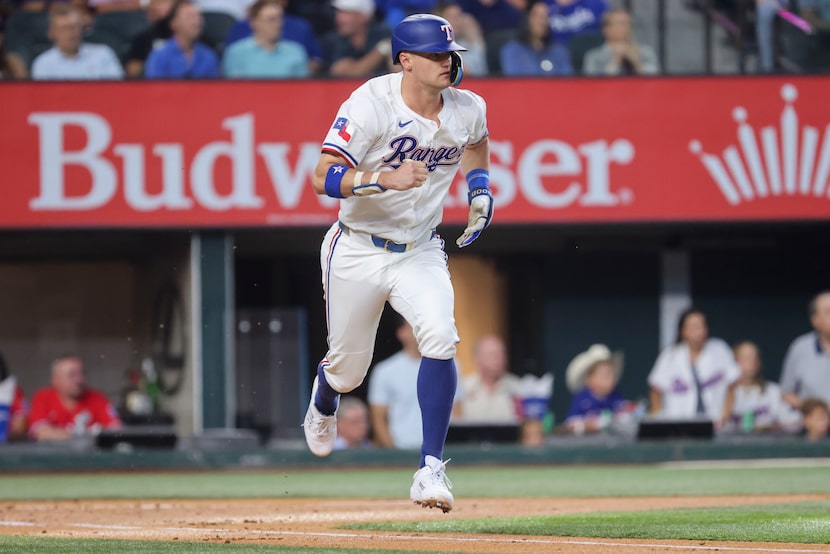 Texas Rangers third base Josh Jung watches as he gets grounds out to Kansas City Royals...