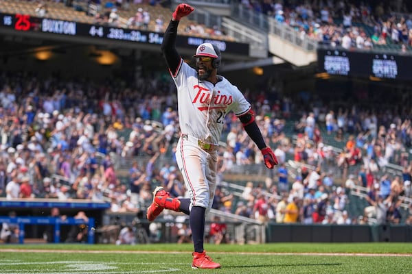 Minnesota Twins' Byron Buxton (25) runs the bases after hitting a solo home run for the cycle during the seventh inning of a baseball game against the Pittsburgh Pirates, Saturday, July 12, 2025, in Minneapolis. (AP Photo/Abbie Parr)