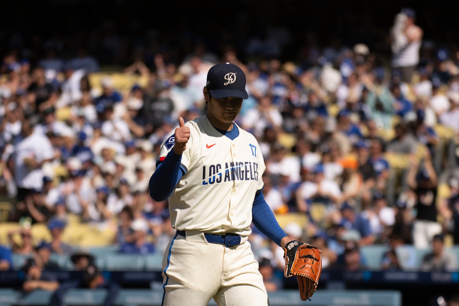 Los Angeles Dodgers starting pitcher Shohei Ohtani gestures during the first inning of a baseball game against the Houston Astros in Los Angeles, Saturday, July 5, 2025. (AP Photo/Kyusung Gong)