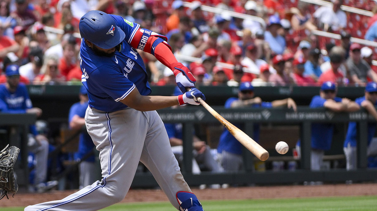 Jun 11, 2025; St. Louis, Missouri, USA; Toronto Blue Jays first baseman Vladimir Guerrero Jr. (27) hits a one run single against the St. Louis Cardinals during the fourth inning at Busch Stadium. 