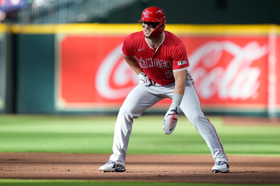 Los Angeles Angels' Mike Trout leads off first base during the first inning of a baseball game...