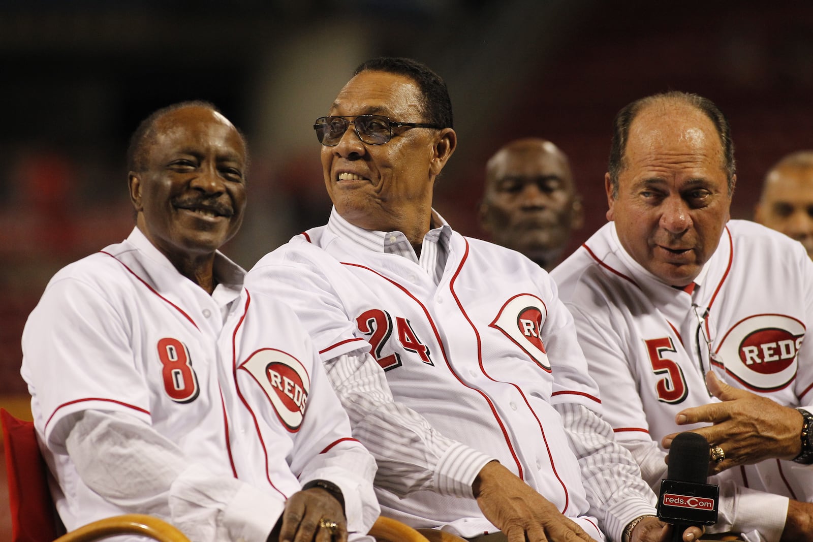 Joe Morgan, Tony Perez and Johnny Bench listen to Pete Rose talk during a ceremony honoring Perez on Friday, Aug. 21, 2015, at Great American Ball Park in Cincinnati. David Jablonski/Staff