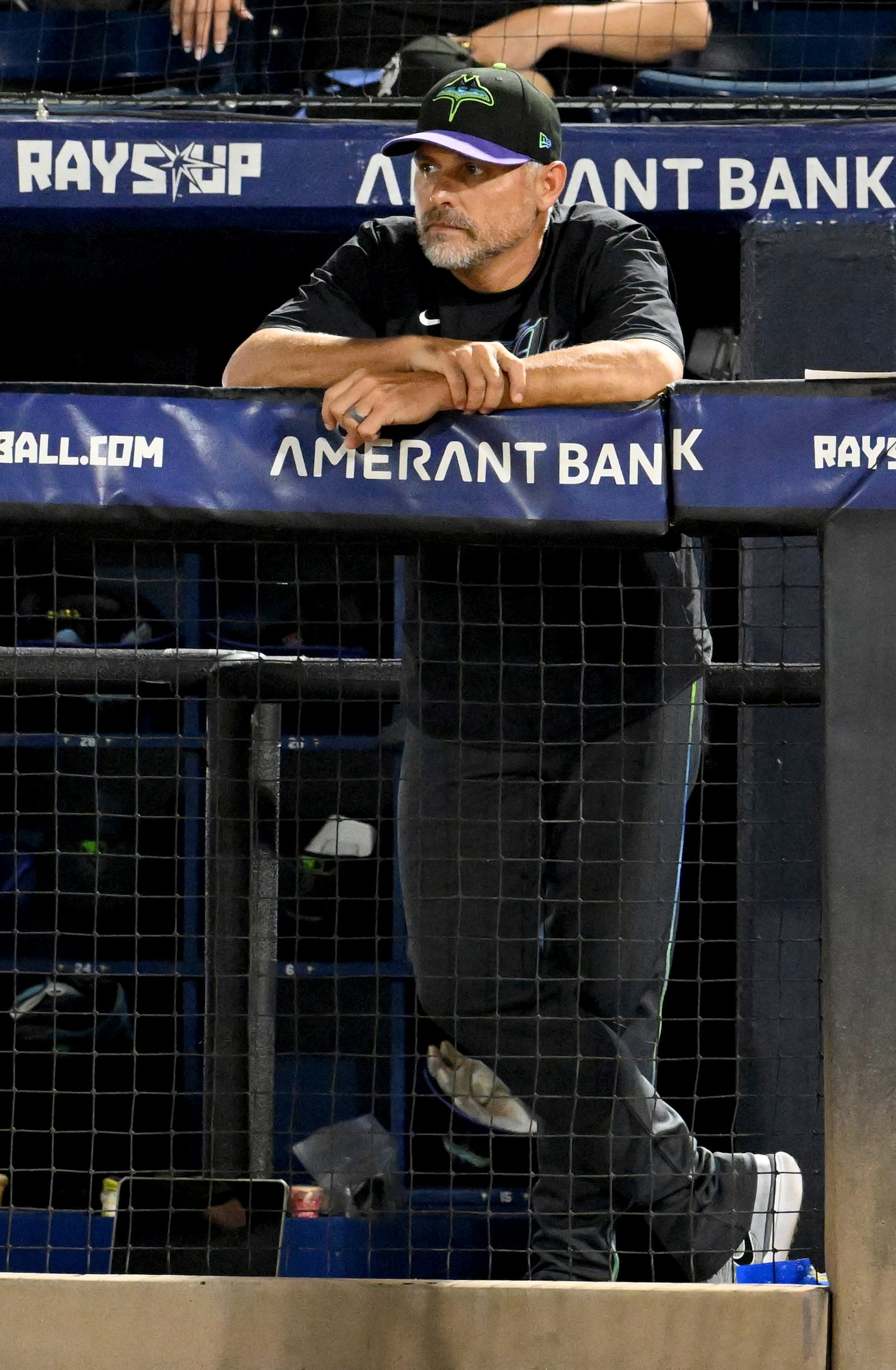 Tampa Bay Rays manager Kevin Cash watches from the dugout during the sixth inning of a baseball game against the Chicago White Sox Tuesday, July 22, 2025, in Tampa, Fla. (AP Photo/Jason Behnken)