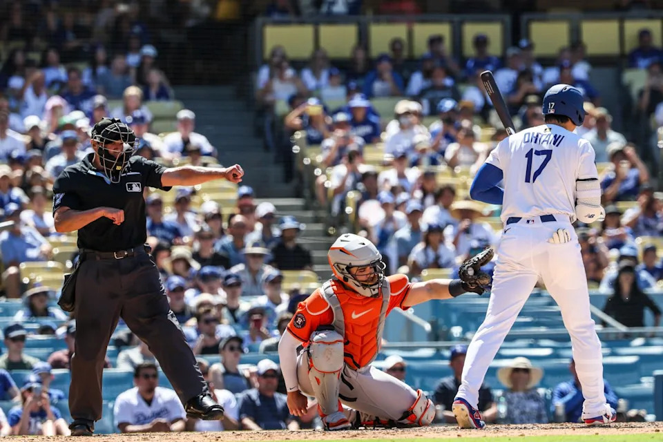 Dodgers designated hitter Shohei Ohtani is called out by umpire Paul Clemons during a loss to the Astros.