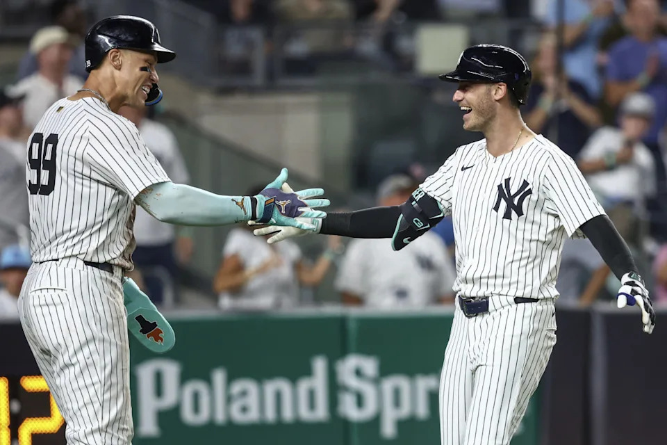 Yankees center fielder Cody Bellinger (35) celebrates with Aaron Judge (99) after hitting a home run against the Cubs at Yankee Stadium.Wendell Cruz-Imagn Images