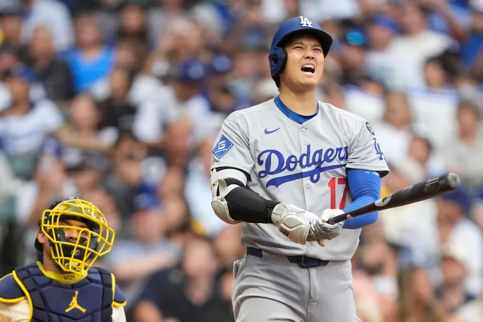 Dodgers designated hitter Shohei Ohtani reacts negatively during an at-bat against the Milwaukee Brewers on Monday.