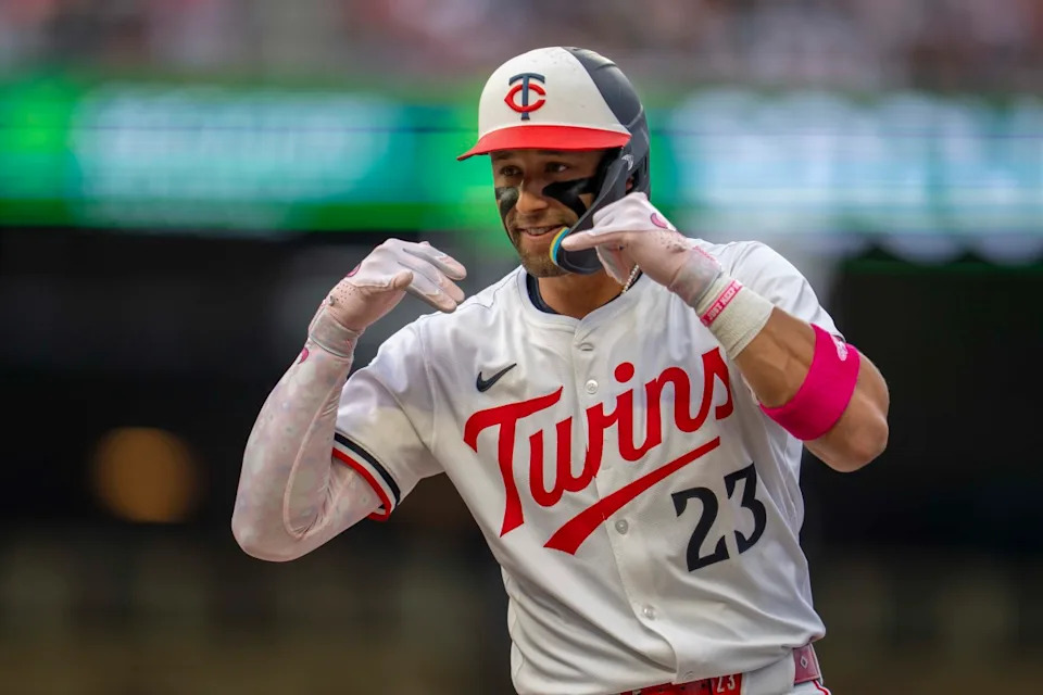 Minnesota Twins third baseman Royce Lewis (23) celebrates after hitting an RBI single against the Texas Rangers in the fourth inning at Target Field.Jesse Johnson-Imagn Images