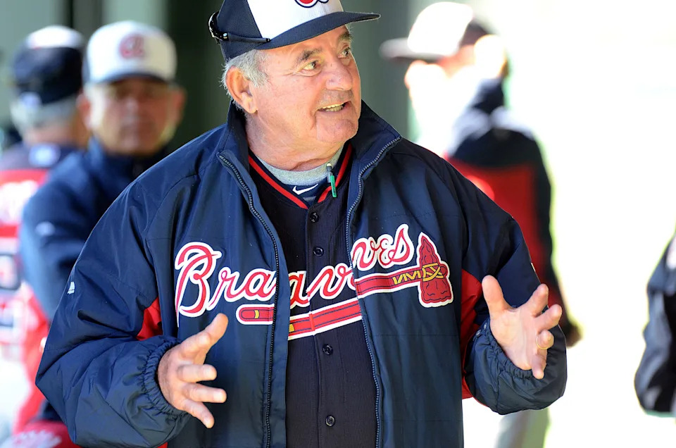 Lee Elia talks to the Atlanta Braves coaches prior to a workout at Champion Stadium on Feb 16, 2014.