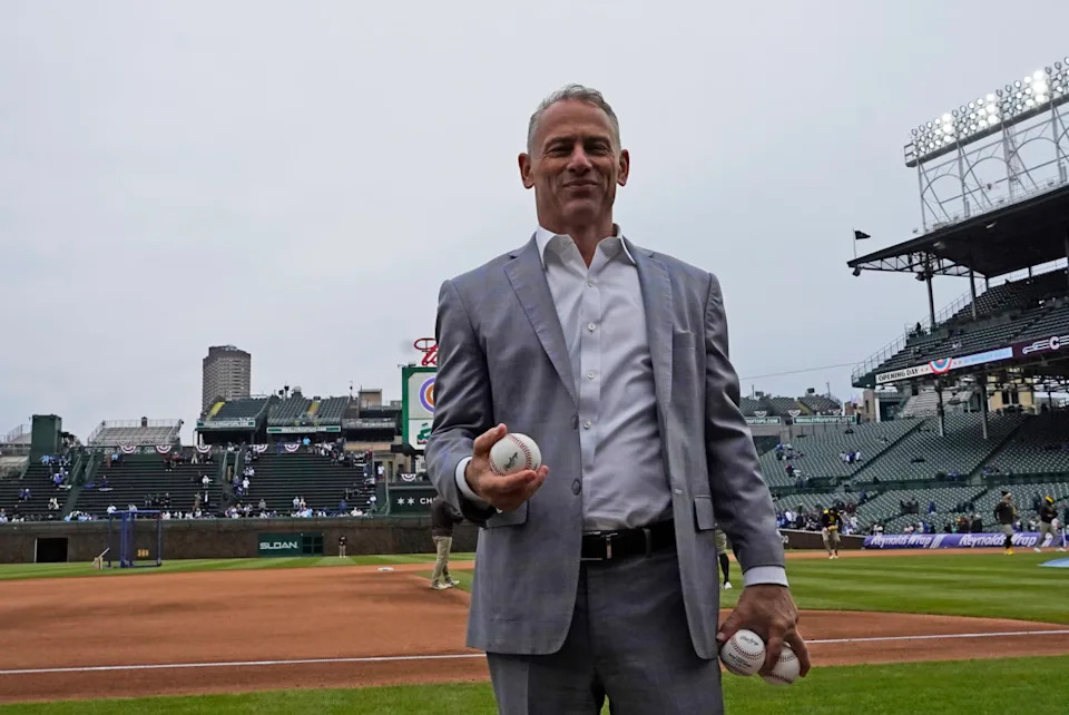 Jed Hoyer, President of the Chicago Cubs, prepares to throw balls to fans before a game against the San Diego Padres at Wrigley Field.David Banks-Imagn Images