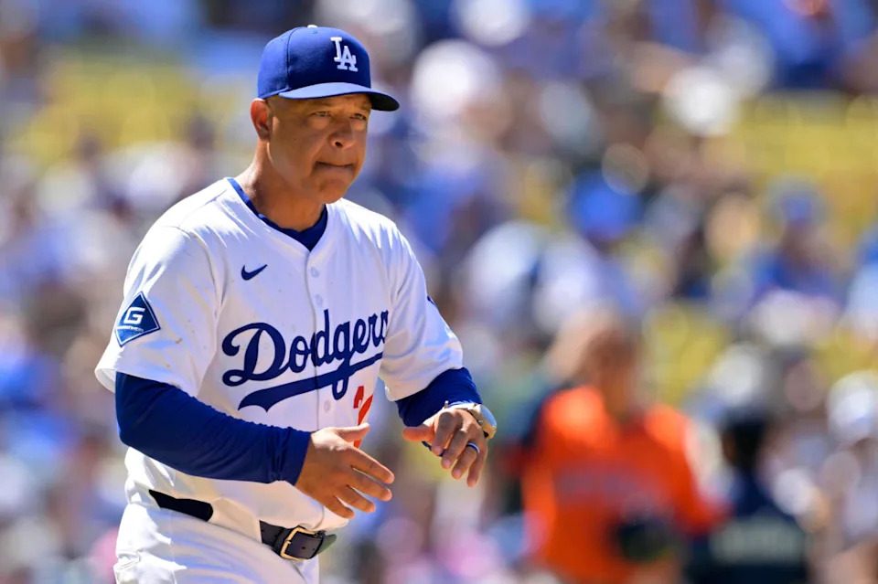  Los Angeles Dodgers manager Dave Roberts (30) walks to the mound for a pitching change in the eighth inning against the Houston Astros at Dodger Stadium.