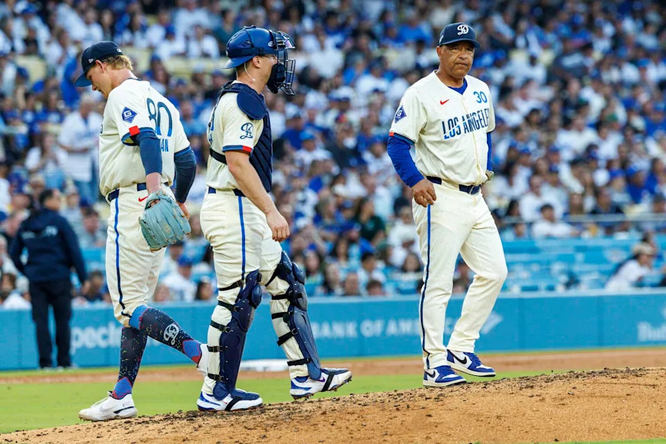 Dodgers manager Dave Roberts, right, stands on the mound near catcher Will Smith after pulling Emmet Sheehan.