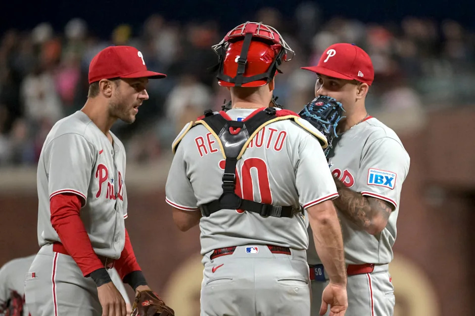 Jul 7, 2025; San Francisco, California, USA; Philadelphia Phillies catcher J.T. Realmuto (10) visits the mound to talk to pitcher Orion Kerkering (50) during the eighth inning at Oracle Park. © Ed Szczepanski-Imagn Images