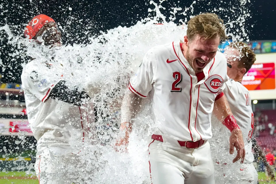 Gavin Lux gets an ice shower from teammates after his walk-off single beat the Yankees in the 11th inning last month at Great American Ball Park.