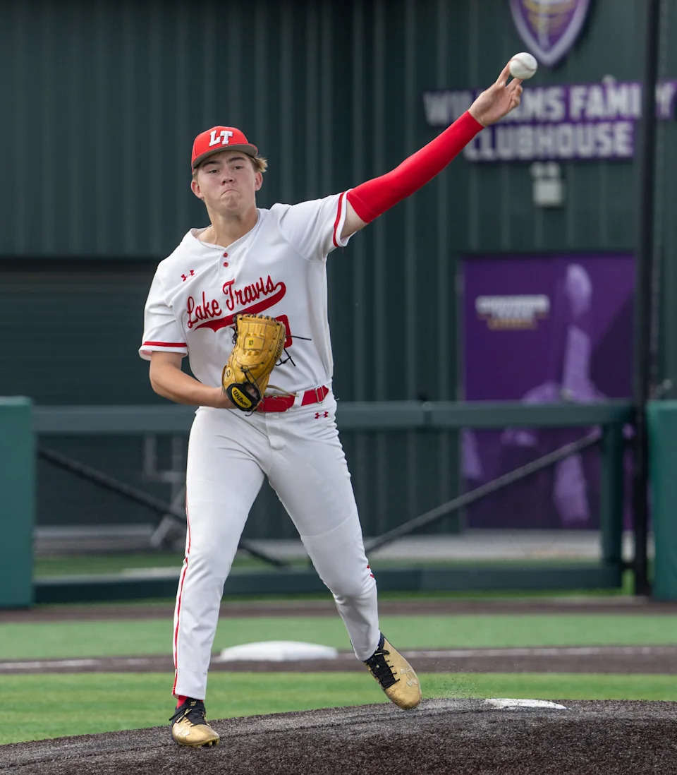 Lake Travis pitcher Luke McBride throws to first base during the Cavaliers' Class 6A Division I regional final against Johnson on May 23.