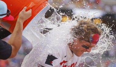 Minnesota Twins' Harrison Bader is doused by teammates after his winning solo home run against the Tampa Bay Rays in the ninth inning of a baseball game Friday, July 4, 2025, in Minneapolis. (AP Photo/Bruce Kluckhohn)