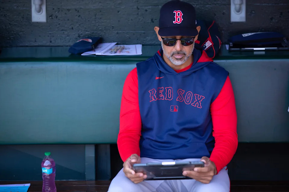 Jun 21, 2025; San Francisco, California, USA; Boston Red Sox manager Alex Cora sits in the dugout before his team takes on the San Francisco Giants at Oracle Park. D&period; Ross Cameron-Imagn Images