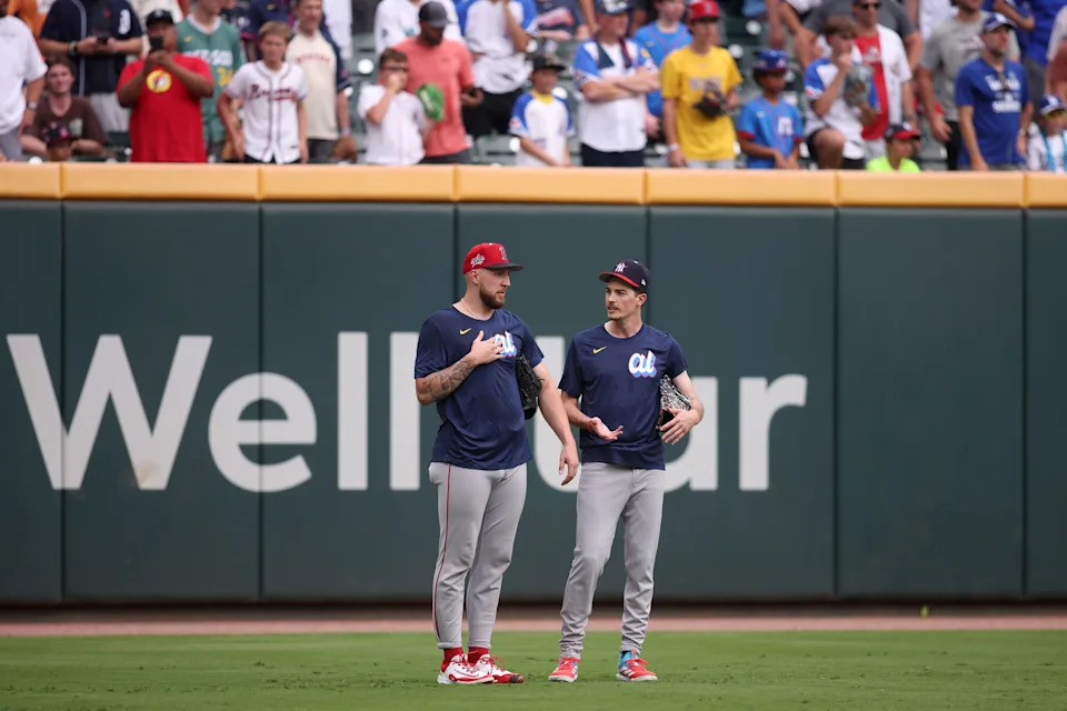 American League pitcher Garrett Crochet (35) of the Boston Red Sox talks with American League pitcher Max Fried (54) of the New York Yankees before the 2025 MLB All Star Game at Truist Park.