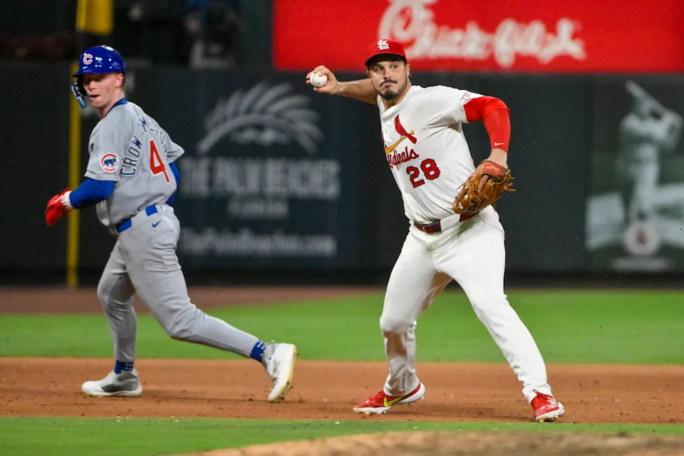 St. Louis Cardinals third baseman Nolan Arenado (28) barehands a ground ball and throws out Chicago Cubs shortstop Dansby Swanson (not pictured)Jeff Curry-Imagn Images