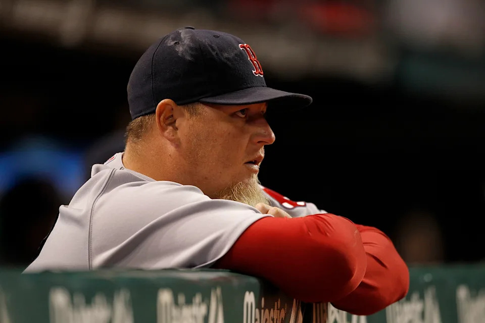 : Bobby Jenks #52 of the Boston Red Sox watches the action during the game against the Cleveland Indians at Progressive Field on April 5, 2011 in Cleveland, Ohio. The Indians defeated the Red Sox 3-1.<p><a href="https://www.gettyimages.com/detail/111694572" rel="nofollow noopener" target="_blank" data-ylk="slk:Leon Halip&sol;Getty Images;elm:context_link;itc:0;sec:content-canvas" class="link ">Leon Halip&sol;Getty Images</a></p>