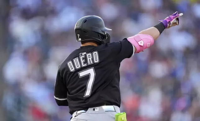 Chicago White Sox's Edgar Quero gestures to the bullpen as he circles the bases after hitting a solo home run off Colorado Rockies starting pitcher Antonio Senzatela in the sixth inning of a baseball game Friday, July 4, 2025, in Denver. (AP Photo/David Zalubowski)