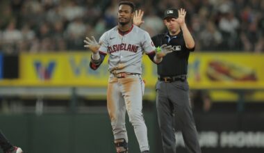 Cleveland Guardians' Angel Martínez, left, celebrates after hitting an RBI double during the seventh inning in the second baseball game of a doubleheader against the Chicago White Sox, Friday, July 11, 2025, in Chicago.