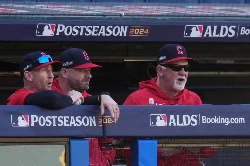 Guardians bench coach Craig Albernaz, left, manager Stephen Vogt, center, and pitching coach Carl Willis, right, watch a simulated game 
