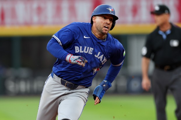 Toronto Blue Jays outfielder George Springer (4) runs to home after Toronto Blue Jays first base Vladimir Guerrero Jr. (27) hit an RBI double during the third inning against the Chicago White Sox at Rate Field Tuesday July 8, 2025, in Chicago. (Armando L. Sanchez/Chicago Tribune)