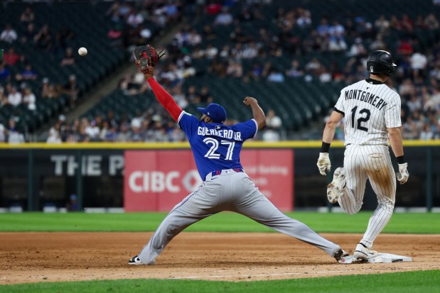 Chicago White Sox shortstop Colson Montgomery (12) reaches first base past Toronto Blue Jays first base Vladimir Guerrero Jr. (27) during the fifth inning at Rate Field Tuesday July 8, 2025, in Chicago. (Armando L. Sanchez/Chicago Tribune)