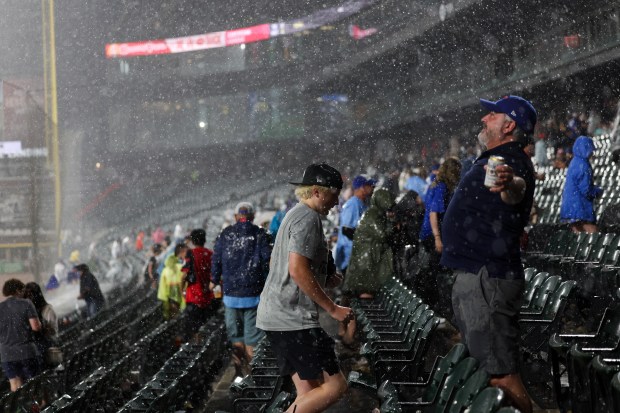People make their way to the concourse during a rain delay while the Chicago White Sox play the Toronto Blue Jays during the seventh inning at Rate Field Tuesday July 8, 2025, in Chicago. (Armando L. Sanchez/Chicago Tribune)
